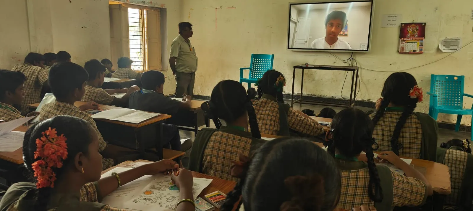 Students in classroom watching a virtual environmental awareness workshop