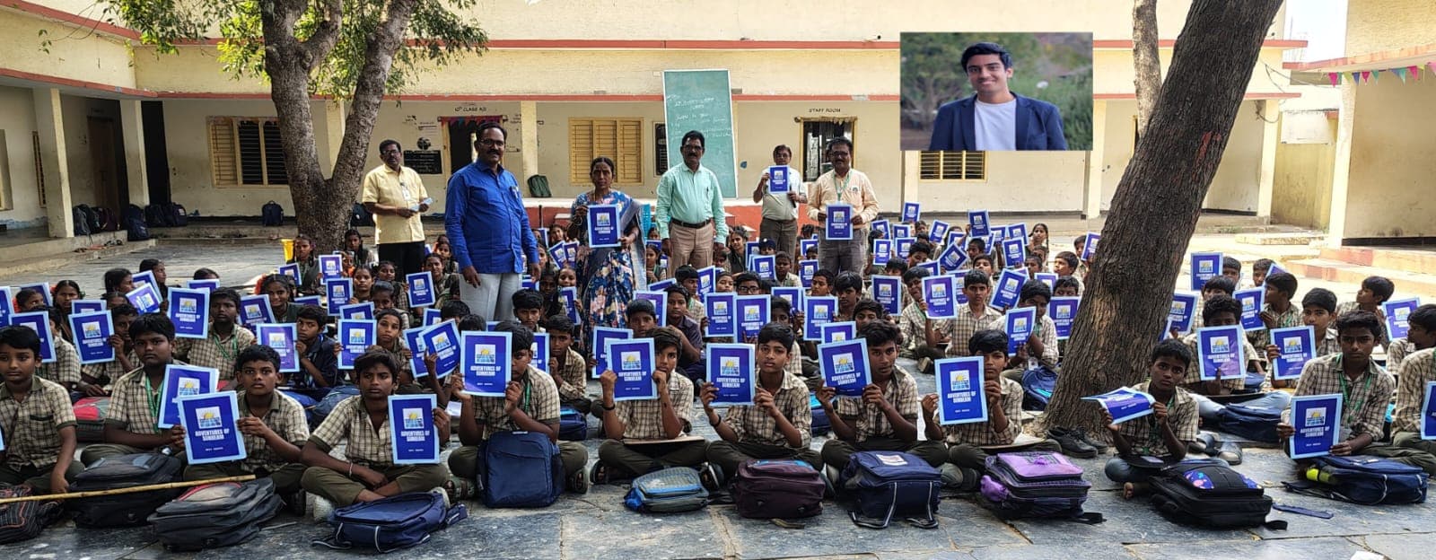 Students holding up copies of Adventures of Sunbeam